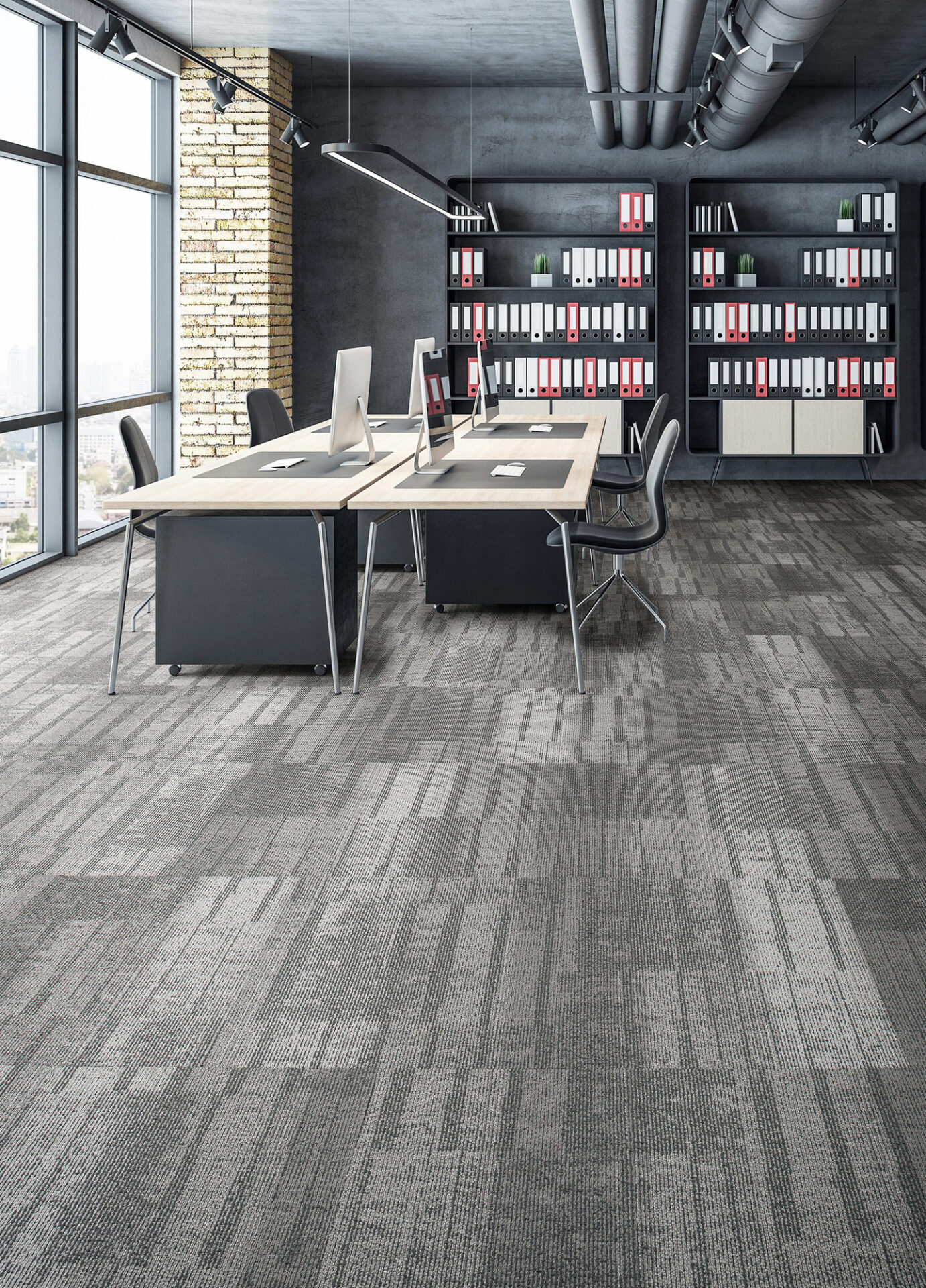 Gray linear carpet tile in a loft-style open office with desks, shelving and tall windows