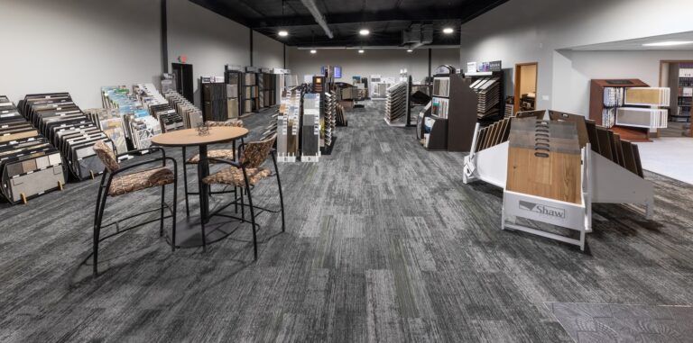 Inside the Harmony Flooring showroom in Madison with flooring sample displays and a seating area