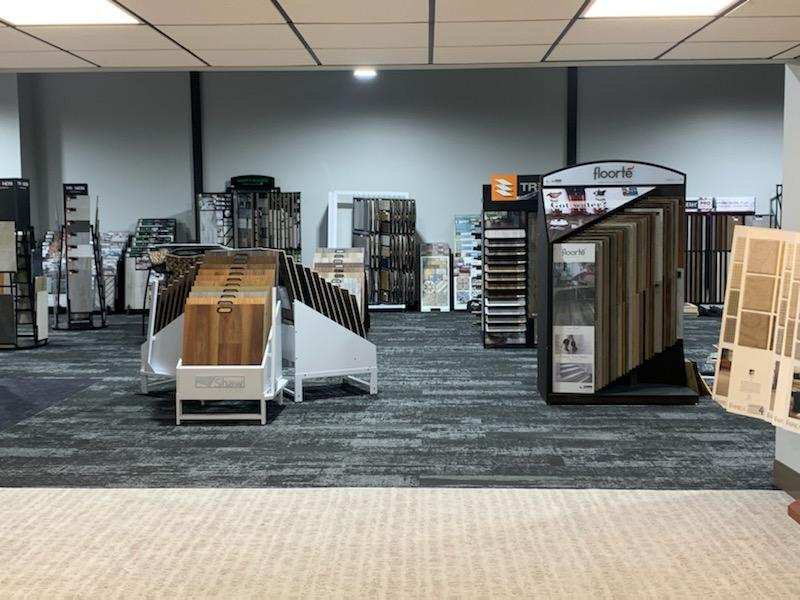 Hardwood, vinyl and carpet sample displays in the Harmony Flooring showroom