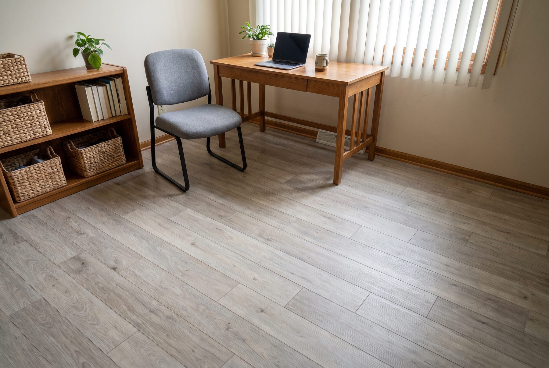 Gray-beige wood-look laminate floor in a home office with a desk